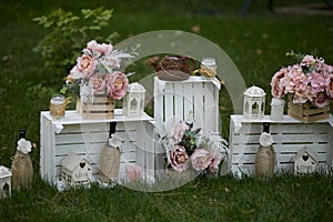 Roses in wooden white boxes for wedding decoration