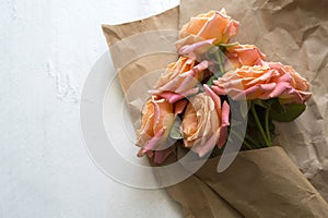 roses are wrapped in craft paper