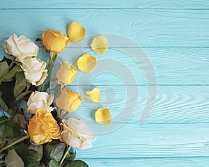 Roses yellow on a minty celebration design wooden background
