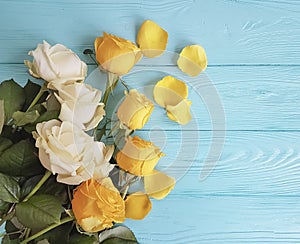 Roses yellow on a minty celebration wooden background