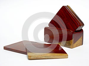 Rosewood coasters on white background