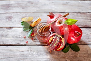 Rosh Hashana concept, jewish New Year holiday with traditional symbols: apples, pomegranate and honey
