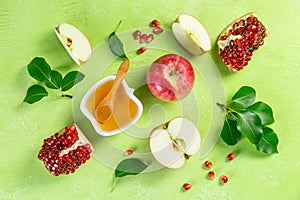 Rosh hashanah concept - honey, apples, pomegranate, symbols