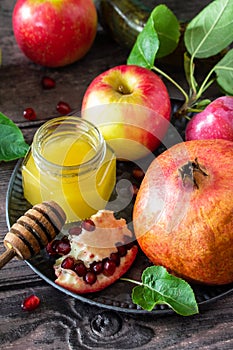 Rosh hashanah hashana - jewish new year holiday concept. Traditional symbols: honey, fresh apples, pomegranate and shofar