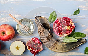 Rosh hashanah  Hashana - jewish New Year holiday concept. Traditional symbols: Honey jar and fresh apples with pomegranate and