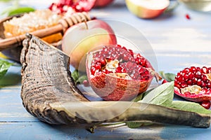 Rosh hashanah  Hashana - jewish New Year holiday concept. Traditional symbols: Honey jar and fresh apples with pomegranate and