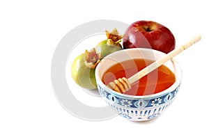 Rosh hashanah (jewesh holiday) concept - honey, apple and pomegranate isolated on white. traditional holiday symbols.