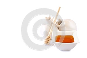 Rosh hashanah (jewesh holiday) concept - honey and pomegranate isolated on white. traditional holiday symbols.