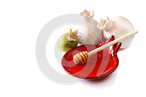 Rosh hashanah (jewesh holiday) concept - honey and pomegranate isolated on white. traditional holiday symbols.