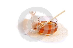 Rosh hashanah (jewesh holiday) concept - honey and pomegranate isolated on white. traditional holiday symbols.