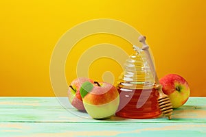 Rosh hashanah Jewish new year holiday celebration concept. Honey and apples