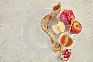 Rosh hashanah, jewish New Year holiday concept. Pomegranate, apples and honey traditional products for celebration