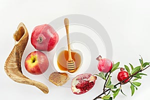 Rosh hashanah, jewish New Year holiday concept. Pomegranate, apples and honey traditional products for celebration