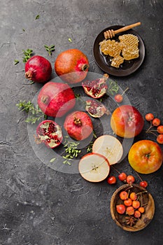 Rosh hashanah - jewish New Year holiday concept. Traditional symbols: Honey jar and fresh apples with pomegranate and shofar -horn