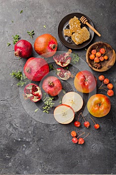 Rosh hashanah - jewish New Year holiday concept. Traditional symbols: Honey jar and fresh apples with pomegranate and shofar -horn