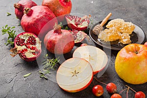 Rosh hashanah - jewish New Year holiday concept. Traditional symbols: Honey jar and fresh apples with pomegranate and shofar -horn