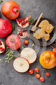 Rosh hashanah - jewish New Year holiday concept. Traditional symbols: Honey jar and fresh apples with pomegranate and shofar -horn