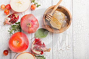 Rosh hashanah - jewish New Year holiday concept. Traditional symbols: Honey jar and fresh apples with pomegranate and shofar -horn