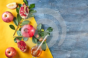 Rosh hashanah - jewish New Year holiday concept. Traditional symbols: Honey jar and fresh apples with pomegranate and shofar -horn