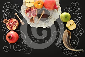 Rosh hashanah & x28;jewish New Year holiday& x29; concept. Traditional symbols. Text SHANA TOVA means HAPPY NEW YEAR.