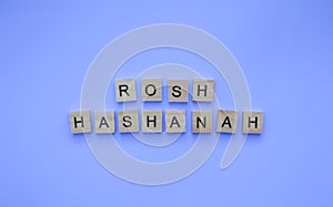 Rosh Hashanah, minimalistic banner with an inscription in wooden letters