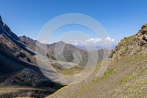 Roshka - A panoramic view on a valley in the Greater Caucasus Mountain Range in Georgia, Kazbegi Region.