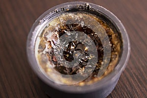 Rosin in a jar on a wooden table