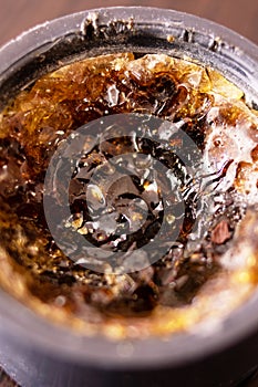 Rosin in a jar on a wooden table