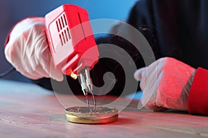 Rosin melting red transformer soldering iron on table