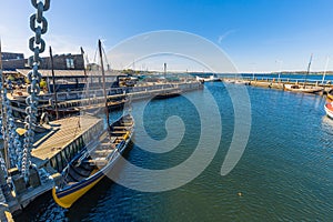 Roskilde, Denmark - May 01, 2017: Viking long boats in the harbor of Roskilde