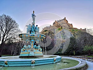 Ross Fountain, Princes Street Gardens, Edinburgh, in front of Edinburgh castle on a bright cold winter morning, frost and icicles