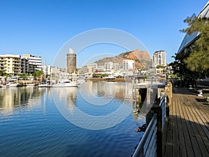 Ross River flowing through Townsville, Australia, with Castle Hill in the background.