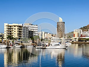 Ross River flowing through Townsville, Australia, with Castle Hill in the background.