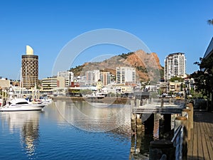 Ross River flowing through Townsville, Australia, with Castle Hill in the background.