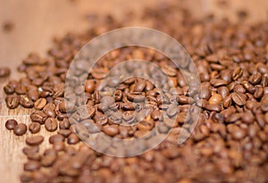 Rosted brown cofee beans, background, close up
