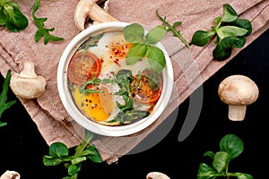 Rosted egg with mushroom, tomato and lettuce