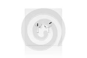Apple AirPods Pro on a white background. Wireless headphones in a box close-up