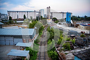 Industrial zone of a city with grain elevator and railway