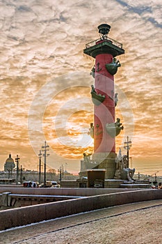 Rostral column at sunset in winter in St. Petersburg, Russia