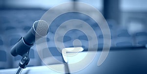 Rostrum with microphone and computer in conference room