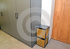 Rotang baskets stand in the corridor near the closet