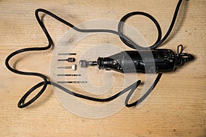 Rotary Tool and Bits on wooden table