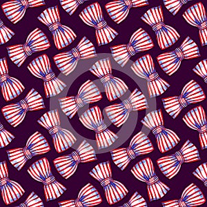 Rotated bows of striped ribbon on the dark background. Watercolor seamless pattern.