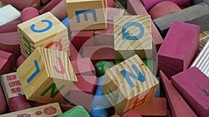 Rotating alphabetical and other toy wooden cubes