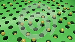 Rotating field of green color with black holes and jumping balls. Animation. Yellow spheres flying above rotating