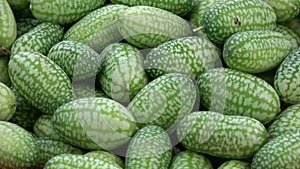 Rotating fresh mouse melons cucamelons background
