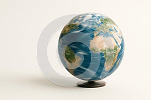 Rotating globe of the Earth on a light background. Space for text.