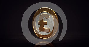 Rotating golden Pound coin above floor on dark background.