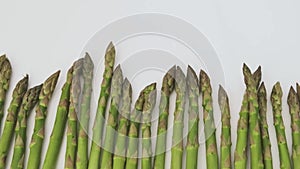 Rotating green fresh asparagus. side view.