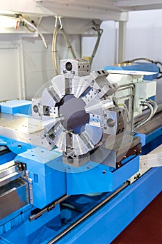 Rotating head in a high precision mechanics plant at CNC lathe